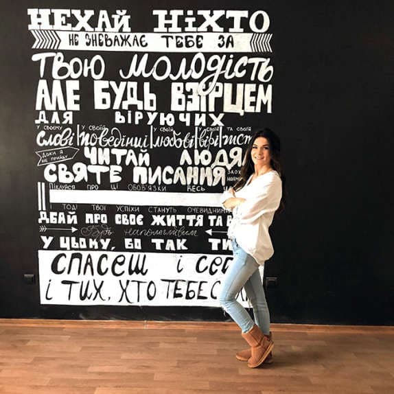 A girl beside a wall